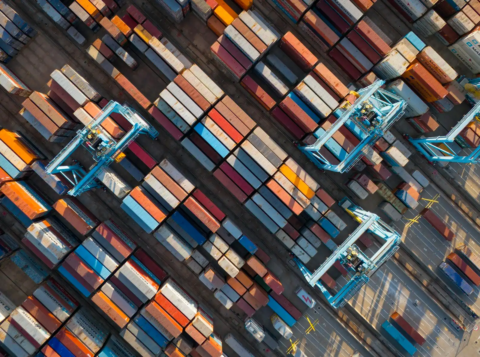 Aerial view of shipping containers and cranes