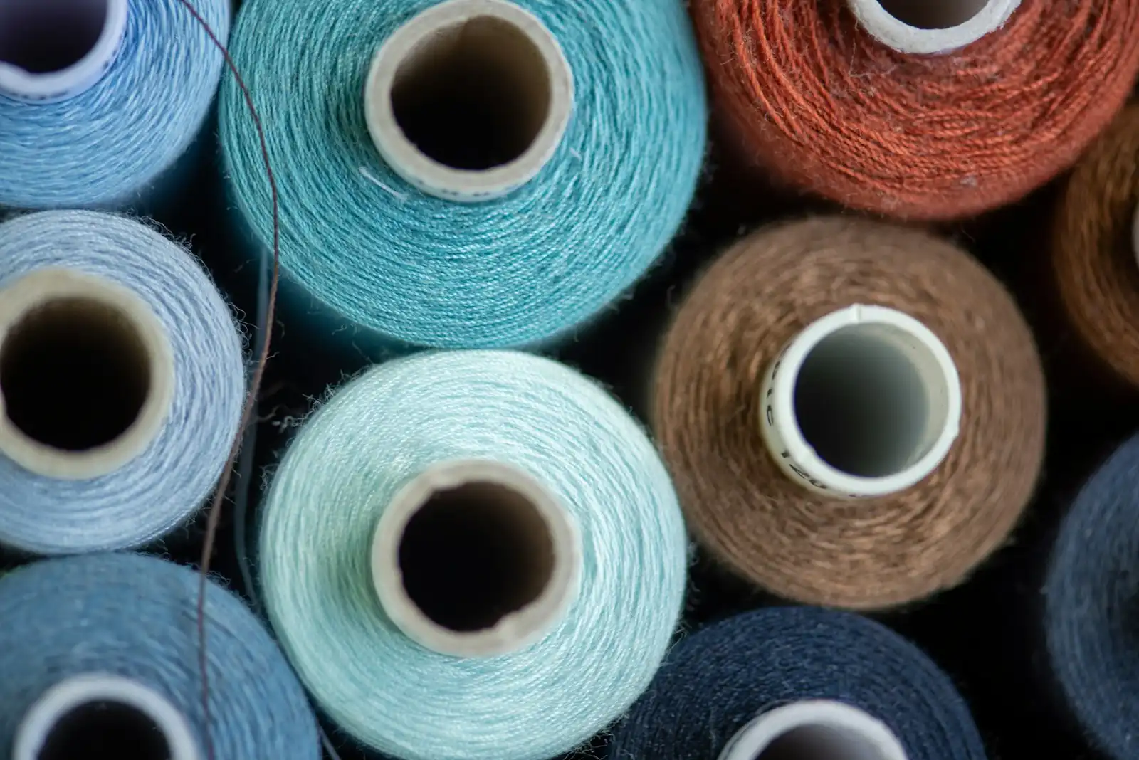 A group of fabric rolls